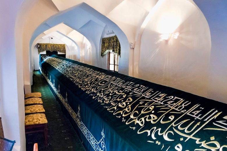 Interior of a mausoleum with calligraphic inscriptions